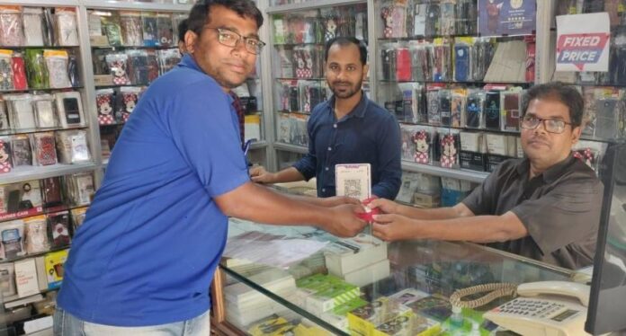 BharatPe executive giving gold coins to shopkeepers