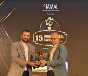 Mr. Harsh Jain, Chairman, IAMAI (left) presenting Mr. Dilip Asbe, MD & CEO, NPCI the India Digital Awards trophy for the Best Digital Person of the Year- Impact Legend