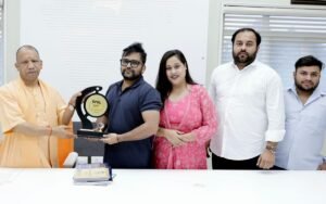 L - R Chief Minister Yogi Adityanath, Sambhav Jain, Smt. Vedika Trivedi, Shri Kunal Sharma, Shri, and Rachit Sharma